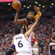 Paul George passes over Cory Joseph in Game One of the Eastern Conference Quarterfinals. Via Getty.